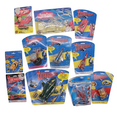 Lot 215 - Eleven Gerry Anderson card-backed toys