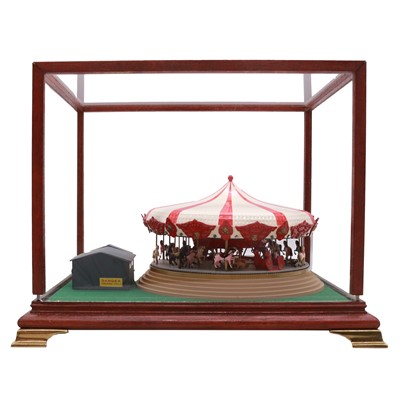 Lot 167 - Two kit built models, including a fairground carousel, and HMS Rodney, both in display cases.