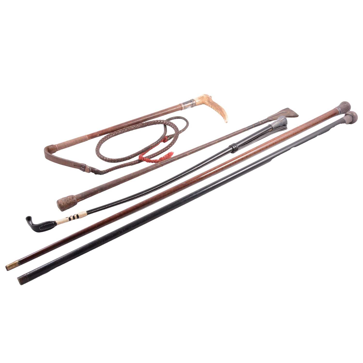 Lot 97 - Two silver-topped canes and three crops