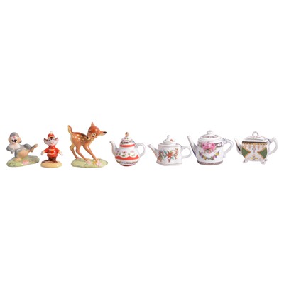 Lot 49 - Three Royal Doulton Showcase figurines, and a collection of twelve miniature teapots