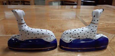 Lot 4 - Pair of Staffordshire dog pen stands, and another pair of smaller dalmation dogs