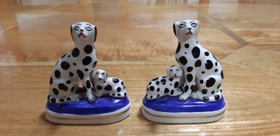 Lot 4 - Pair of Staffordshire dog pen stands, and another pair of smaller dalmation dogs