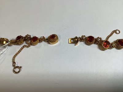 Lot 249 - A hessonite garnet and seed pearl graduated riviere necklace.