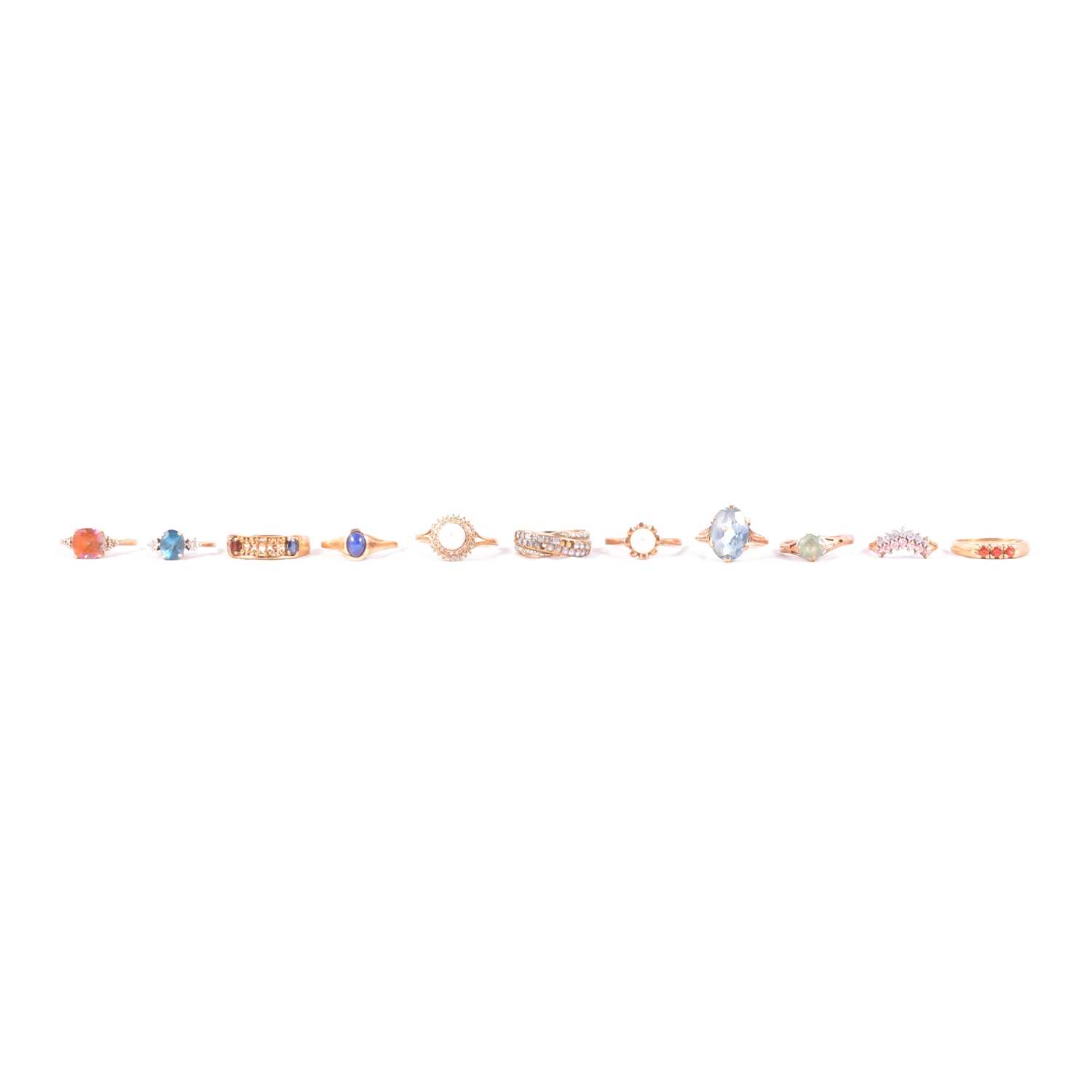 Lot 64 - Eleven rings, topaz and diamond, pearl and diamond, and others.