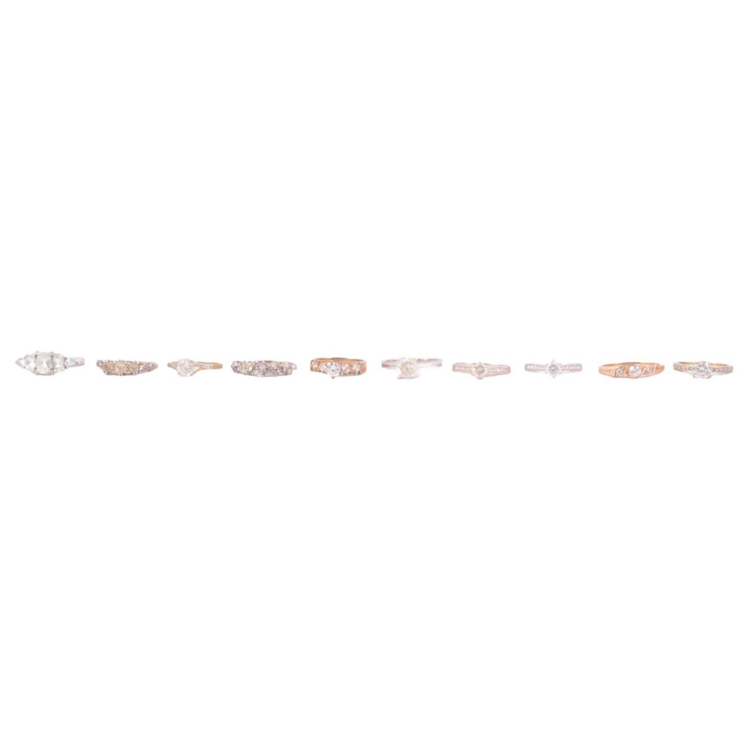 Lot 63 - Ten synthetic white stone rings.