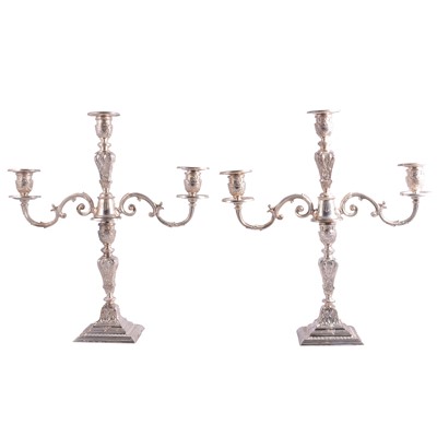 Lot 92 - Pair of George III style silver three-light candelabra