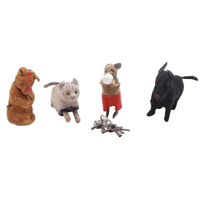 Lot 314 - Three Schuco clockwork toys, and another of a Bear