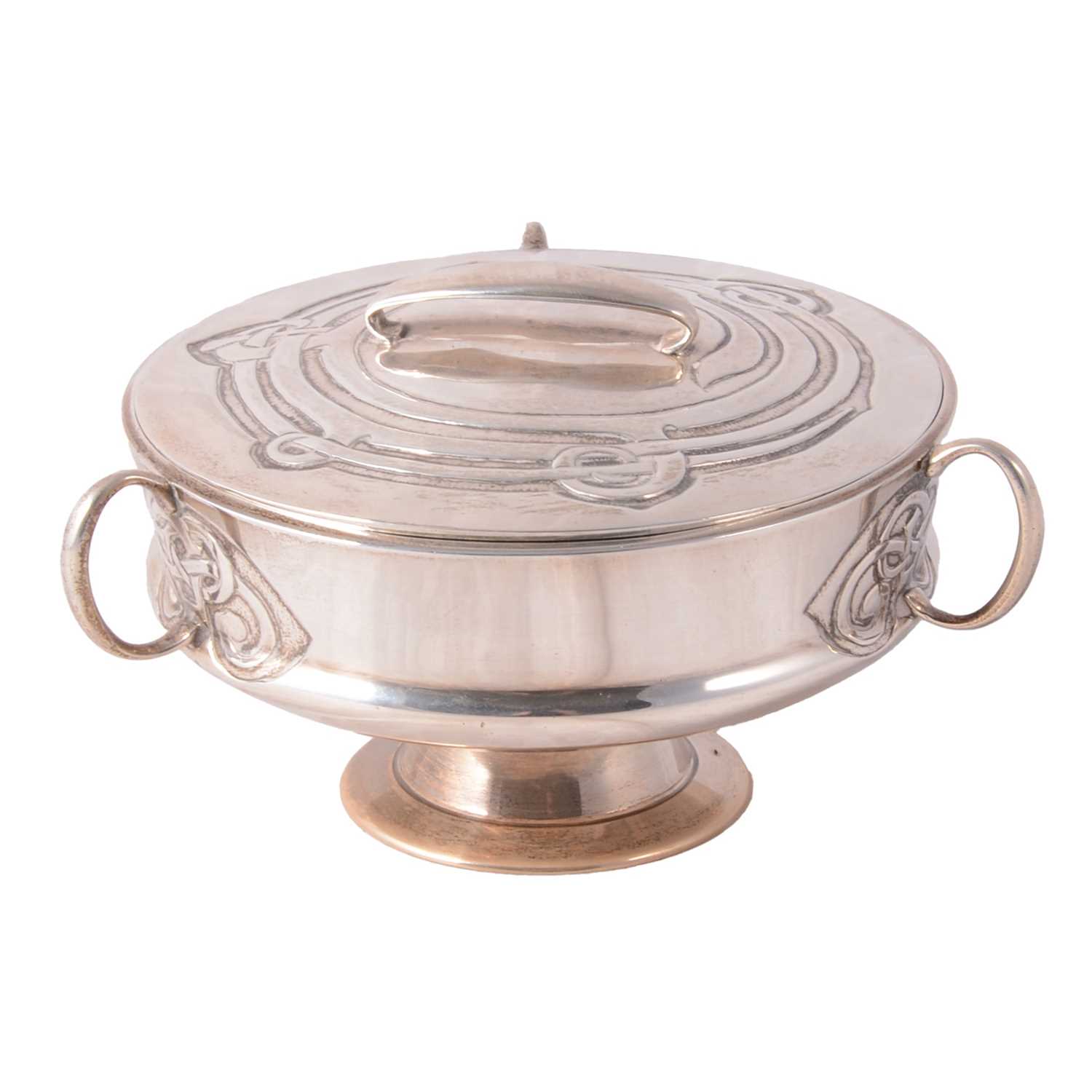Lot 135 - Archibald Knox for Liberty & Co., a Cymric silver muffin dish and cover, 1902