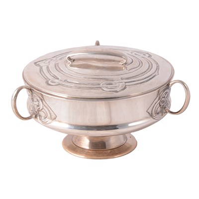 Lot 135 - Archibald Knox for Liberty & Co., a Cymric silver muffin dish and cover, 1902