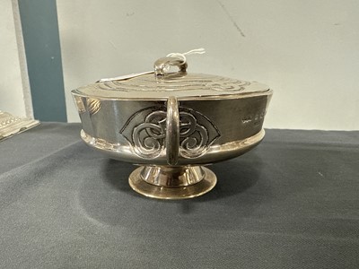 Lot 135 - Archibald Knox for Liberty & Co., a Cymric silver muffin dish and cover, 1902