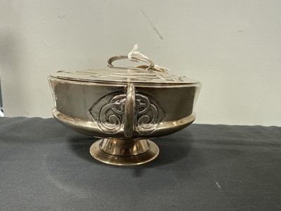 Lot 135 - Archibald Knox for Liberty & Co., a Cymric silver muffin dish and cover, 1902