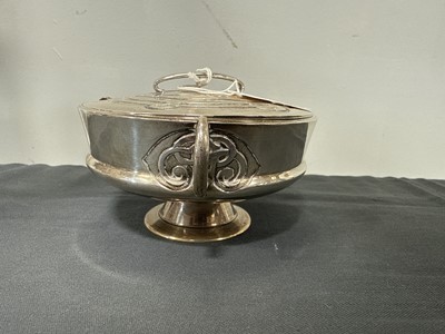 Lot 135 - Archibald Knox for Liberty & Co., a Cymric silver muffin dish and cover, 1902