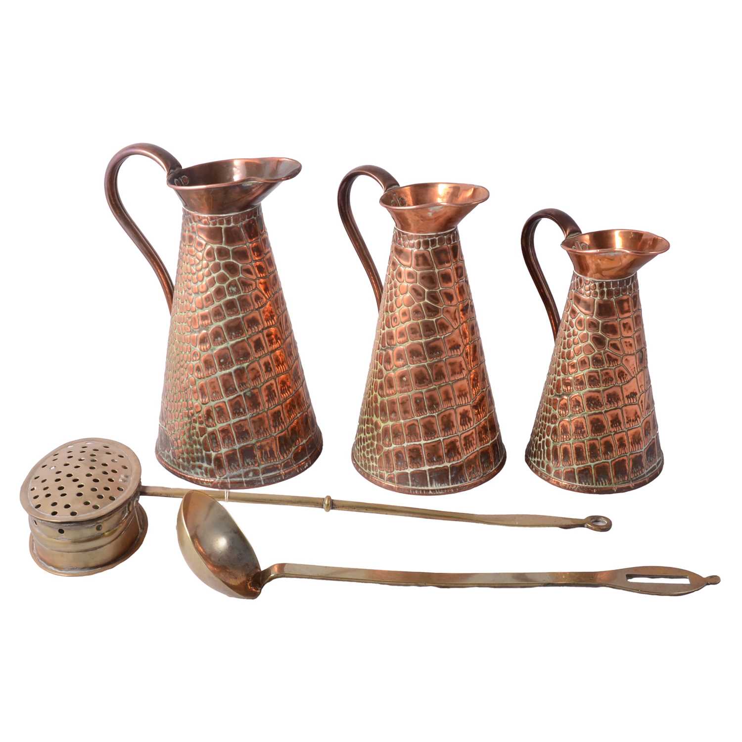 Lot 120 - Set of three graduating copper jugs, brass chestnut roaster and a ladle