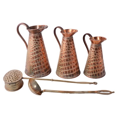 Lot 121 - Set of three graduating copper jugs, brass chestnut roaster and a ladle