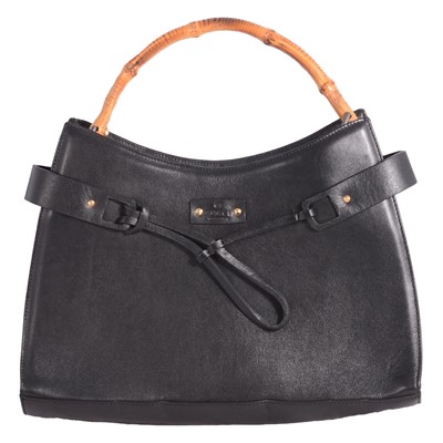 Lot 554 - Gucci - a leather handbag with bamboo handle.