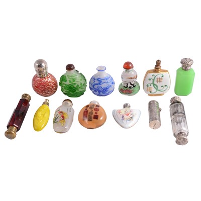 Lot 298 - Small collection of Victorian and later glass scent bottles, some with silver lids, some double-ended.