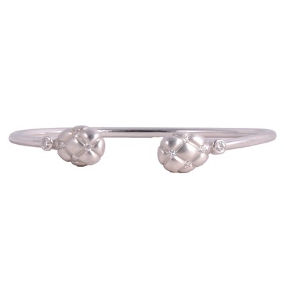 Lot 211 - Fabergé - an 18 carat white gold and diamond Treillage design bangle.
