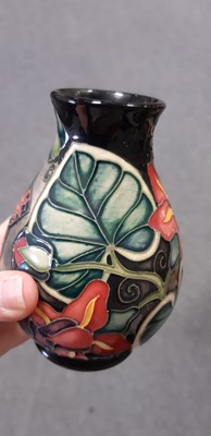 Lot 13 - A Moorcroft table lamp and vase.