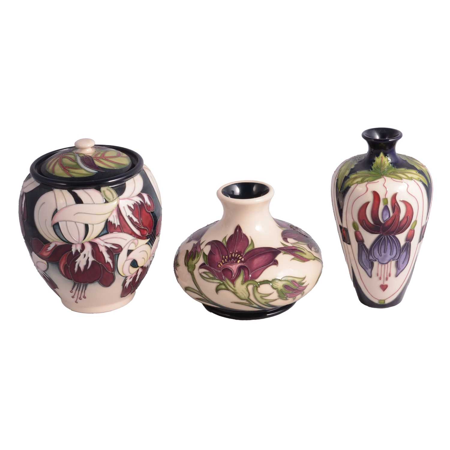 Lot 9 - Two Moorcroft vases and a lidded jar.