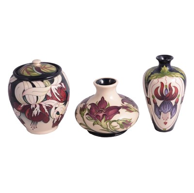 Lot 9 - Two Moorcroft vases and a lidded jar.