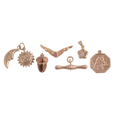 Lot 187 - Four yellow metal charms, T bar, and amethyst and paste set pendant.