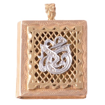 Lot 281 - A yellow metal Quran locket with synthetic white stone lettering.