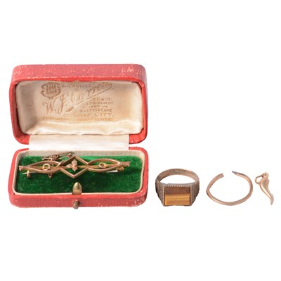 Lot 150 - A yellow metal charm, 9 carat gold bar brooch, and two rings.