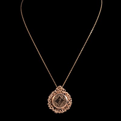 Lot 287 - A 9 carat yellow gold locket and chain.