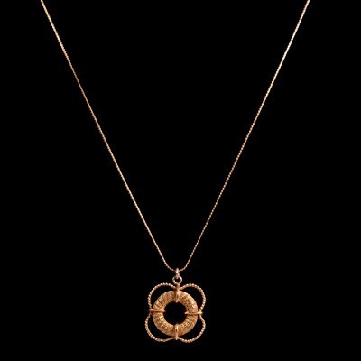 Lot 282 - A yellow metal lifebuoy pendant and 750 chain.