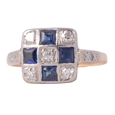 Lot 32 - A sapphire and diamond pave set cluster ring.