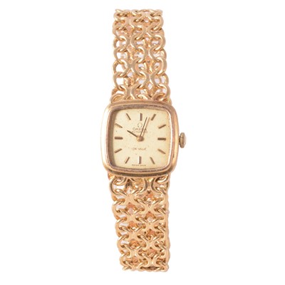 Lot 1057 - Omega - a lady's 18 carat yellow gold De Ville automatic wristwatch.