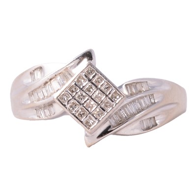 Lot 89 - A modern diamond cluster crossover ring.