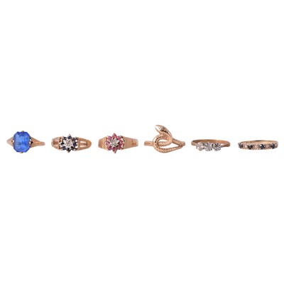 Lot 16 - Four gemset 9 carat gold rings, a yellow metal gemset ring, and a gold snake ring.