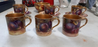 Lot 29 - Set of six Royal Worcester fruit painted coffee cans and saucers, and a sugar bowl