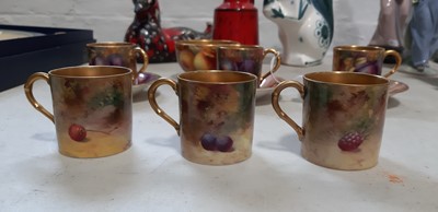 Lot 29 - Set of six Royal Worcester fruit painted coffee cans and saucers, and a sugar bowl
