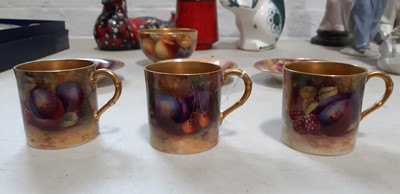 Lot 29 - Set of six Royal Worcester fruit painted coffee cans and saucers, and a sugar bowl