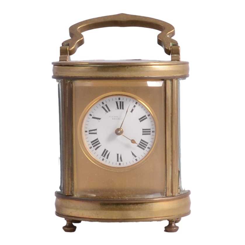Lot 112 - Small oval carriage clock
