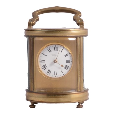 Lot 112 - Small oval carriage clock