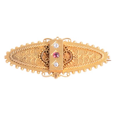 Lot 231 - A Victorian Etruscan style diamond set oval bar brooch.