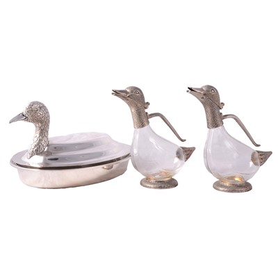Lot 74 - Two silver-plated glas duck carafes, and a lidded stainless steel serving dish.