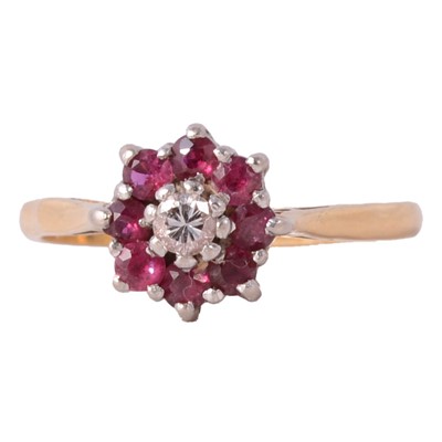 Lot 50 - A 1960's ruby and diamond reverse cluster ring.
