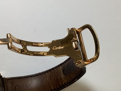 Lot 1004 - Cartier - a Tortue 18 carat yellow gold manual wind wristwatch.