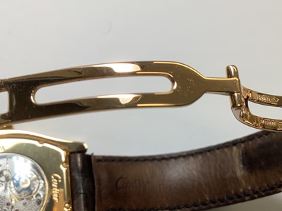 Lot 1004 - Cartier - a Tortue 18 carat yellow gold manual wind wristwatch.