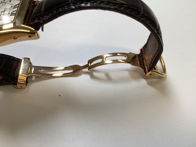 Lot 1004 - Cartier - a Tortue 18 carat yellow gold manual wind wristwatch.