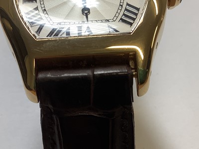 Lot 1004 - Cartier - a Tortue 18 carat yellow gold manual wind wristwatch.