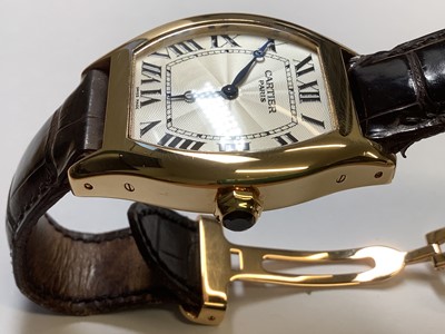 Lot 1004 - Cartier - a Tortue 18 carat yellow gold manual wind wristwatch.