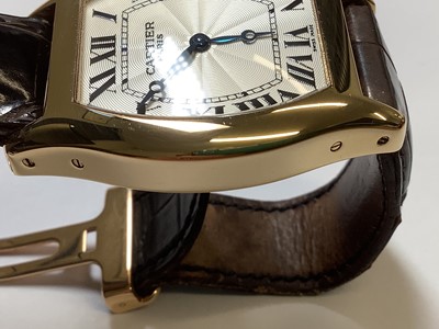 Lot 1004 - Cartier - a Tortue 18 carat yellow gold manual wind wristwatch.
