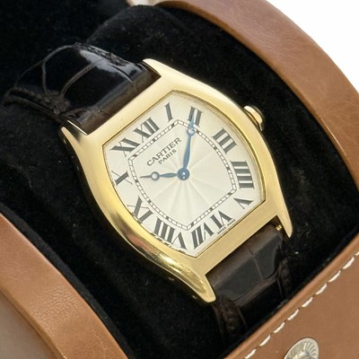 Lot 1004 - Cartier - a Tortue 18 carat yellow gold manual wind wristwatch.
