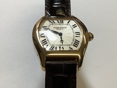 Lot 1004 - Cartier - a Tortue 18 carat yellow gold manual wind wristwatch.