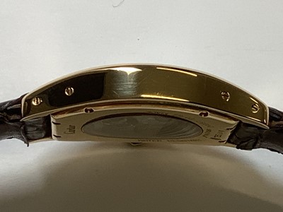 Lot 1004 - Cartier - a Tortue 18 carat yellow gold manual wind wristwatch.